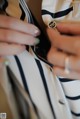 A close up of a woman's hands with a ring on her finger.